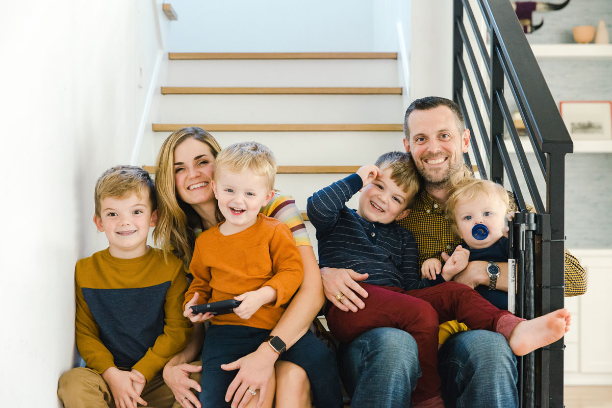 The Dalton family sitting together on their stairs